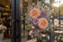 AI application concept — Rainbow holographic printable vinyl: Printed floral holographic window decal in natural sunlight