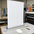 Graphictac 10mil anti-curl roll-up banner media assembled in a trade show display stand application