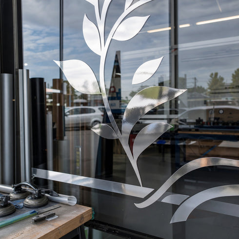 Graphictac mirror-like silver chrome bubble-free printable vinyl used for retail window graphics