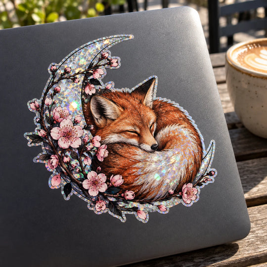 AI application concept — Illustrated fox decal concept with shattered-ice holographic details on a laptop